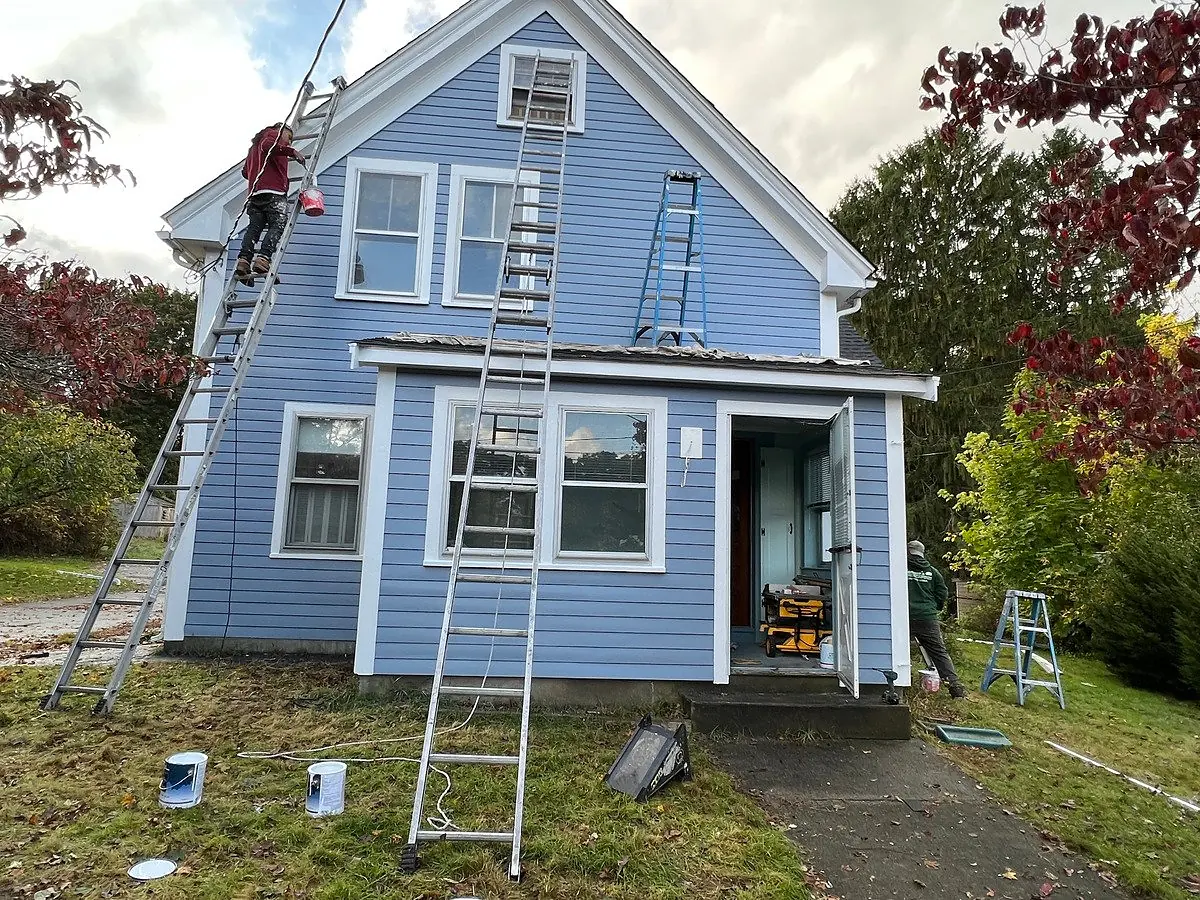 After: cape with old dark shingles repainted light blue